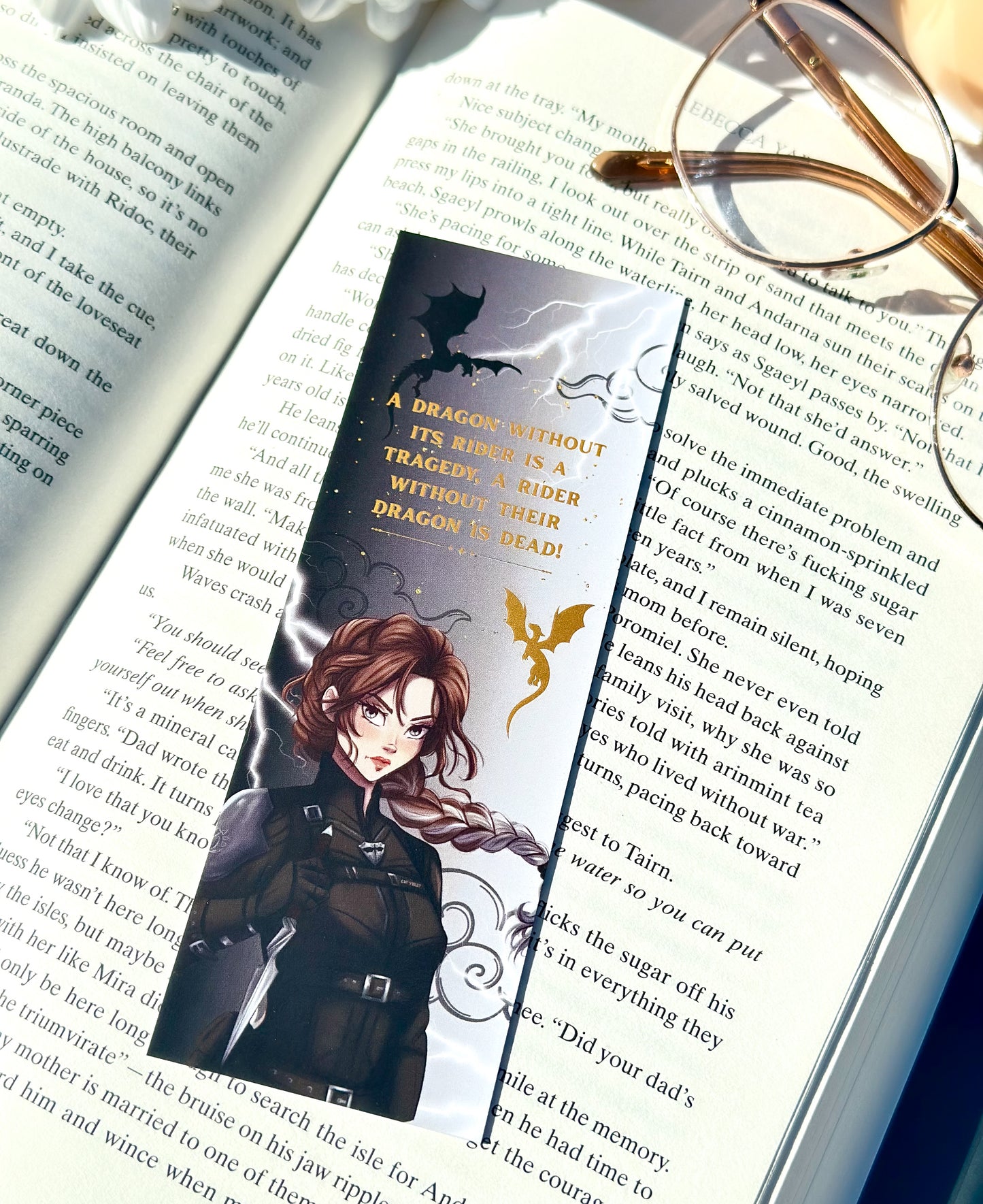 Bookmark with a dragon and Violet sorrengail design on an open book