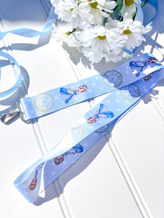 Lanyard with Chibi Cinderella character design on a light blue background with flowers.