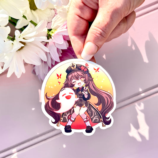 Sticker of a Hu Tao genshin impact character held by a hand with flowers in the background