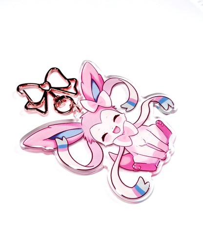 Kawaii sylveon acrylic keychain with metal rose gold clip. cute keychain of sylveon from pokemon. pink aesthetic bag accessory. focusing on the side view to see the resin doming of keychain.