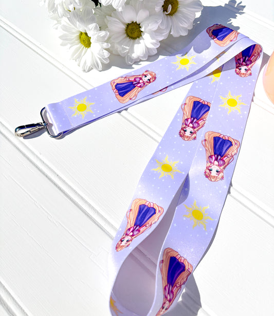 Lanyard with Rapunzel character design on a light purple background with flowers in the corner