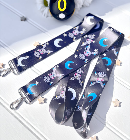 featuring 2 designs of umbreon on a lanyard, one classic and the other a shiny umbreon pokemon