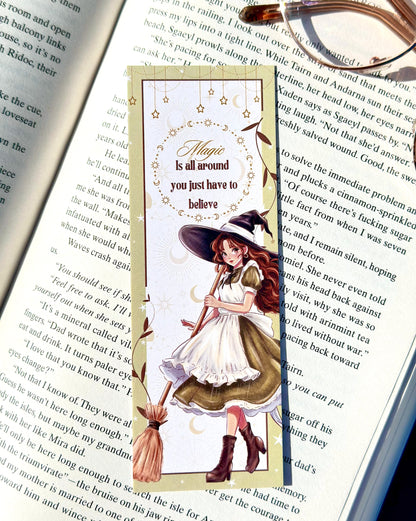 Magical-themed bookmark with a witch design on an open book.