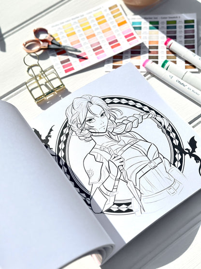 Colouring book with a completed illustration of a character, surrounded by art supplies including scissors and colour swatches.