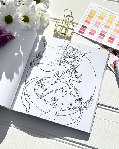 Colouring book page with a fairy design, flowers, and colour swatches on a white surface.